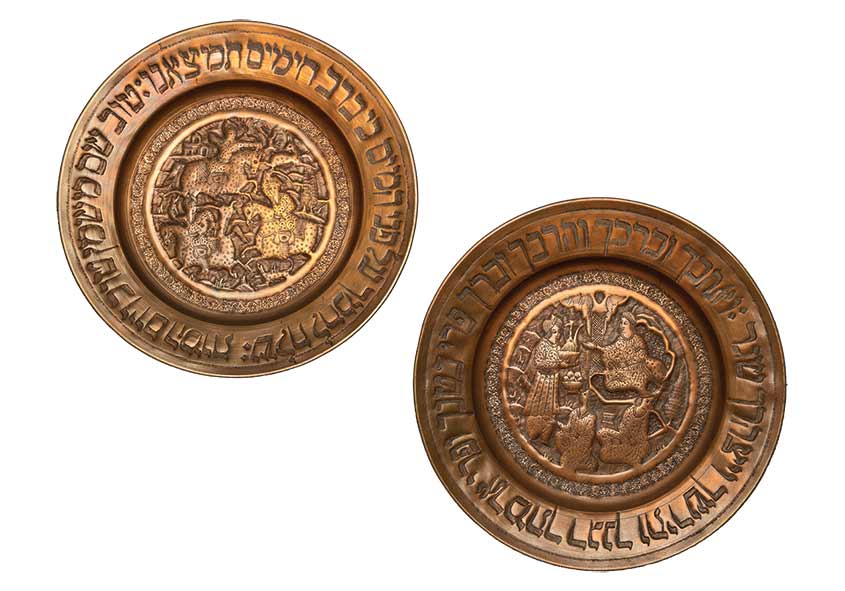 Two embossed copper plates.