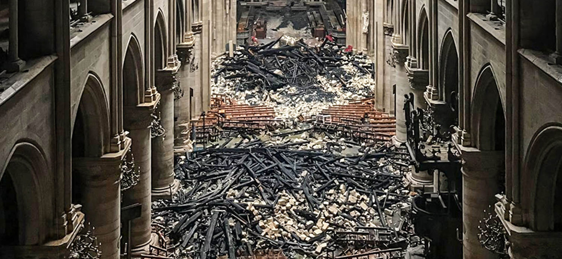 Piles of burnt timber and shattered limestone inside the cathedral.