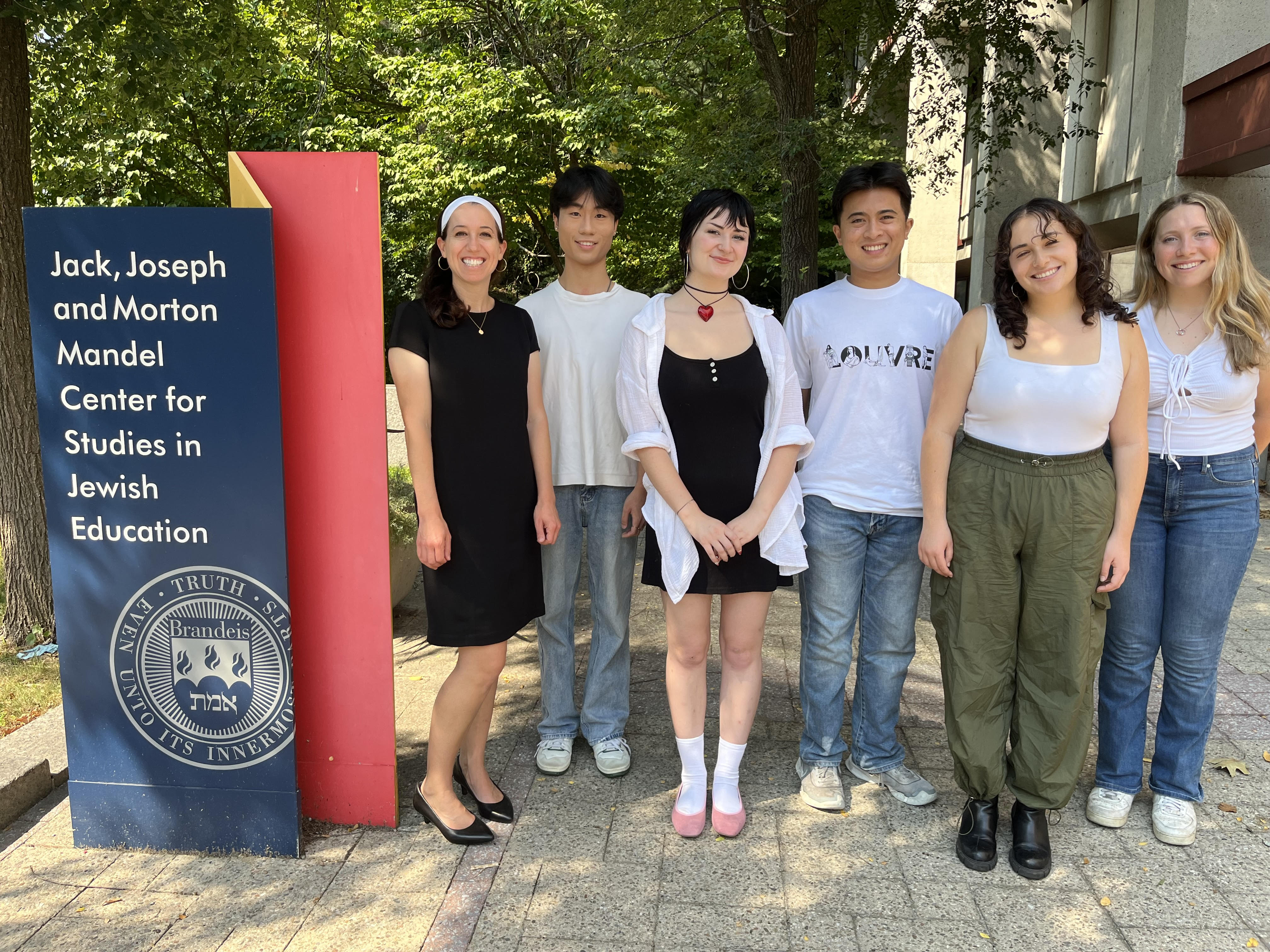 5 students and Professor Ziva Hassenfeld standing in a group